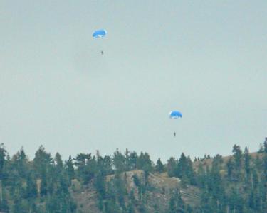 Two of four smoke jumpers observed arriving on Sawmill Mountain to attack the Saw Fire just before 2 p.m. on Sunday Aug. 12, 2012. [Photo by Douglas Page]