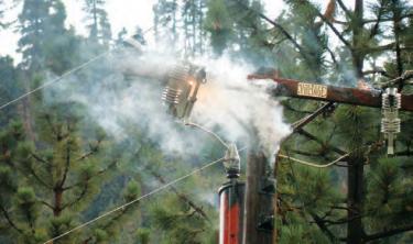 The rains started Saturday afternoon,Aug. 11 quickly turning to torrents down Pine Mountain community streets. Kern County firefighters released water on the high voltage pole fire in short bursts, to avoid allowing the electricity a path down the water to the fireman.