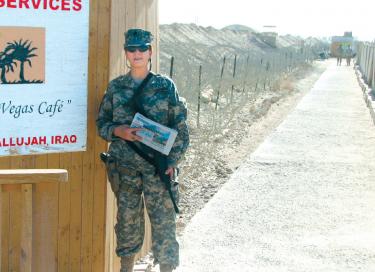 Lt. CMDR Melinda Michael at Camp Fallujah in Iraq with her hometown paper, The Mountain Enterprise.
