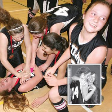 Giggling and tears both call for a quick mock-CPR as 7th grade Badgers celebrate their victory. Inset photo: Coach Vickie Mullen and center Katy Teare share a hug after the long game (Mullen photos).

