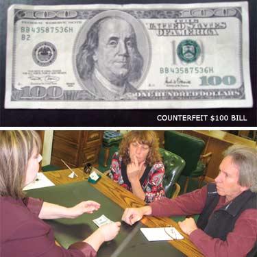 Antelope Valley Bank Branch Manager Kelli Strahl (above) shows Pam Sturdevant and Gary Meyer of The Mountain Enterprise how to spot a bogus $100 bill. At top is a close-up image of the 