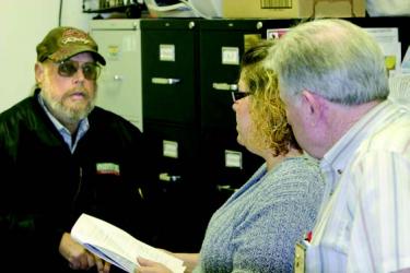 Vietnam veteran Ron Fuller (left) explains his difficulties to Veterans Service Representative Jeannine Waits and Supervisor Michael Penney. They will now be coming each month to help local vets.

