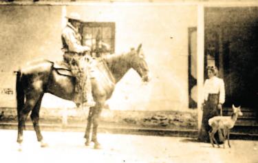 Pictured on the horse in the front of the Liebre Adobe is Tejon Ranch Foreman Antonio Araujo. By the front door is Antonio's daughter, Sally, with her pet antelope. The photo was taken in 1903.
