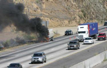 This photo shows the flames and smoke shortly after the big rig caught fire. [Gary Meyer Photo]




