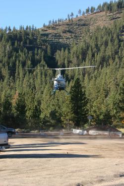 A sheriff's helicopter lands at the Mil Potrero Y to transport armed officers to the marijuana grow field found north of Cuddy Valley. [The Mountain Enterprise photo]







