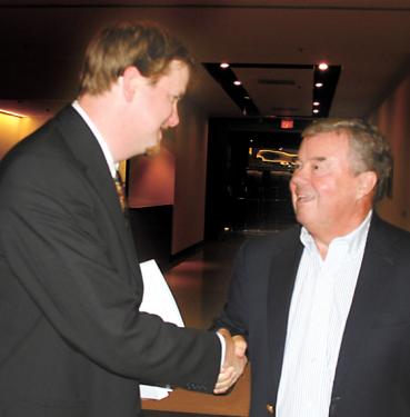Cordial Foes Shake Hands after 3-2 Vote: Attorney Adam Keats (l) shakes hands with
Tejon Ranchcorp CEO Bob Stine (r) as Tejon Mountan Village cruises toward Kern County green light and then lawsuits over California condor by Keats? Center for Biological Diversity. 


