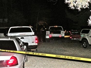 The scene on Laurel Avenue in front of the Shropshire family home near North End Drive on the evening of Sunday, Nov. 22 as a homicide investigation begins. The identity of the deceased has not yet been confirmed. [Mountain Enterprise photo]





















