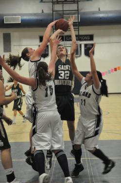 Katy Teare and the lady Falcons join together to block a St. Bonaventure basket attempt.