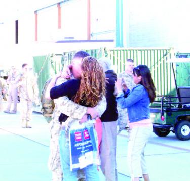 Sergeant Matthew Rabun and his new wife Shelbie Castanon greeted each other at the airport as he returned from Iraq last week.
