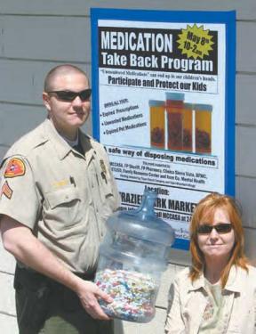 Kern County Sheriff’s Senior Deputy Richard Garrett and McCASA’s Anne Weber with 14.5 pounds of pills from Medication Take Back Program. 