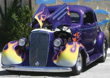A 1935 Chevy Coupe aflame in front of Alpine Lumber & Mercantile. See more in the slideshow above.