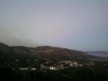 This shot by Dylan Keenberg at about 7:30 p.m. is looking down on the hamlet of Frazier Park from his family home at the peak of Oakmont Trail. In contrast to those taken in the valley, this photo shows the fire has mellowed on the ridge, he said. Keenberg wrote earlier that from his perch it appears the fire is most active in a direction away from the town. In this more comprehensive picture, the fire looks like it is settling down, he said.