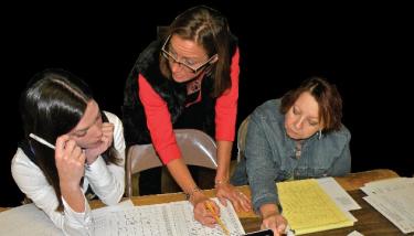 (l-r) Julie Karpenko and Angel Cottrell review the  draft of a community survey with Pam McCain and other members of the SBDC Strategic Advisory Council.