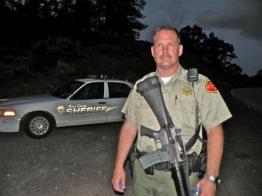 Deputy Jeff Eveland hiking back up from the site of a pot farm grow discovered Sunday in rugged terrain within a half mile of Pine Mountain homes.[Hedlund photo]