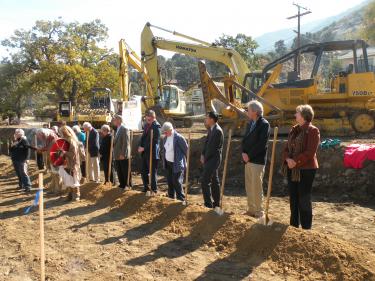 This photo of the groundbreaking in November 2009 shows the heritage oak woodland chosen for the library. It also shows that protective fencing is not in place.