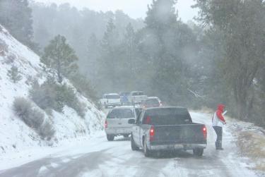 Cars stopped in the middle of Mil Potrero Highway after skidding on ice. Those equipped with four-wheel drive and snow tires or chains were able to navigate slowly, but safely.