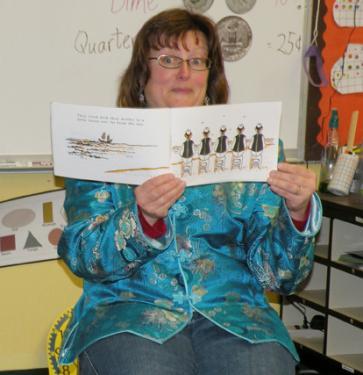 Listeners were enchanted by the tale of the Six Chinese Brothers, read by Susan Edwards (above) at The Frazier Park School Book Fair last year, which runs all week March 7-11. The event also raises funds for the school.