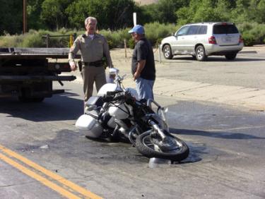 A mangled motorcycle in the middle of the northbound lane of Lebec Road, in front of the post office where, witnesses say, a white pickup truck pulled out in front of the motorcycle which was traveling northbound. [photo by The Mountain Enterprise]