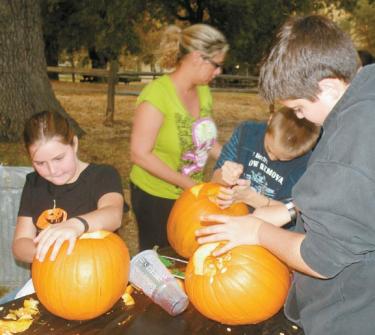 Nothing says &quotHalloween" like carving jack-o-lanterns. This crew were hard at work last year at the Fort Tejon ghost walk. [Check back, additional photos being added]