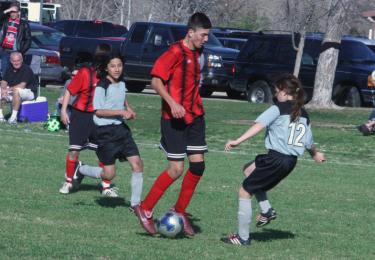 Ericka Steere was defending and Matthew Kjenaas was running behind a player who was over 6 feet tall at the third game of the Sectional AYSO playoffs Saturday, Feb. 24.