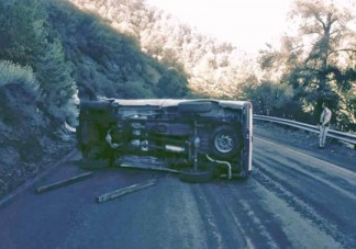 A pickup truck that rolled over Wednesday, Jan. 14 on the s-curves in Pine Mountain Club [photo from Edmond's Towing]