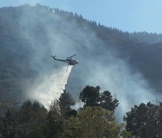 Scott Robinson sent this photo of the fire being extinguished by Kern County helicopter 408 plus ground crews in Frazier Park. (4:40 p.m. appx)