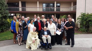Above, At Loyola Marymount University Chapel for their 50th anniversary reading of their vows, Fred Kiesner is standing fourth from the left in the middle row and Elaine is third from the right wearing a white smock. Below, Elaine and Fred at their wedding on July 18, 1964 in Pleasant Hill, California.