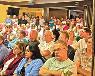 Ten years ago, in 2009, over 160 worried Pine Mountain Club homeowners turned out to protest the PMCPOA board’s failure to answer questions on finances and a rumored plan to abolish the PMC Security Patrol. In 2017, voters passed two bylaws: to require a vote of homeowners before spending over $1 million; and to prohibit taking the POA into over $1 million in debt without a vote of the members. [photo by Patric Hedlund, The Mountain Enterprise]