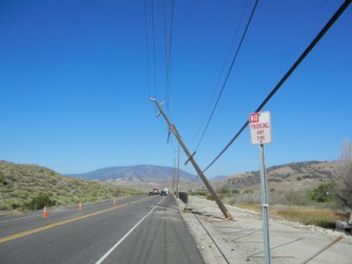 Looking west at the Highway 138 road closure and snapped power pole. [photo by Jeff Zimmerman]