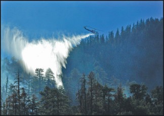 Chuchupate Ranger Station helicopter 530 makes a water drop on the fire. [photo by Marvin Anfinson]