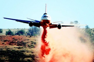 A DC-10 drops retardant during a very low pass over the Powerhouse fire. The fire started May 30 in the Green Valley area and quickly gained momentum, devouring over 32,000 acres. [photo by Jeff Zimmerman]