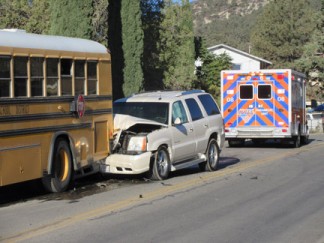 One of two SUVs that were involved in a collision with a school bus on Wednesday, Oct. 5 at Alcot Trail and Mt. Pinos Way. At least one child in one of the SUVs sustained minor injuries. No children aboard the school bus had been reported injured as of 8:20 a.m. according to Kern County Fire Captain Bullock. [photo by Gary Meyer, The Mountain Enterprise]