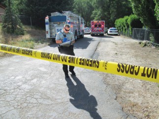 Starr Court after the shooting, Saturday, May 24. The ambulance left empty. Then the coroner came. [photo by Gary Meyer]