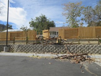 Dollar General's fence was smashed. [photo by Gary Meyer, The Mountain Enterprise]