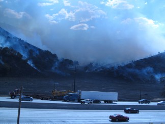 A heavy cloud of smoke is seen from the Interstate 5 Lebec Road overpass in this photo by Shelly Borgstrom of Frazier Park. the photo looks across the interstate, toward O'neill Canyon, Lance Borgstrom reports.
