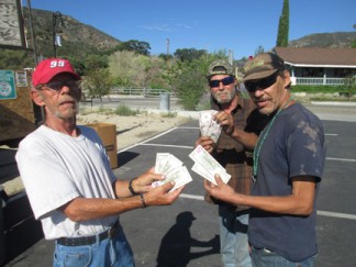 Randy Whitbread, ‘Just plain David’ and Robert Singleton took away $41 cash in exchange for their cans and bottles. [photo by Gary Meyer]