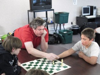 Teacher Chuck Mullen coached students for a chess tournament in 2014. Now he is taking on administrative duties at Frazier Park School. [photo by Gary Meyer, The Mountain Enterprise]