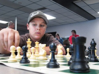 Chess coach Chuck Mullen is forming teams to compete in tournaments for the Enrichment Day for K-12 students on Saturdays, March 14 and 21, 8 a.m. to 12 p.m. His Dads & Lads Tournament invites fathers and friends to join in the fun.  [photo by Gary Meyer]