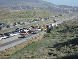 The scene at southbound I-5 about two miles south of Gorman School Road. All lanes are closed as the medevac helicopter prepares for takeoff. [photo by Gary Meyer]