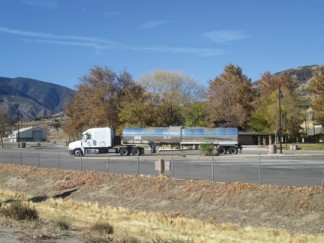 The leaking tanker sits in the southbound rest area. [photo by Gary Meyer]