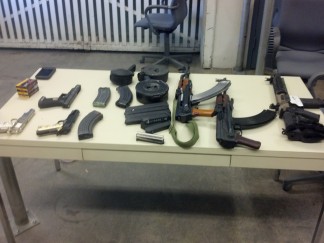 Assault rifle and other weapons shown in photos from the Kern County Sheriffs Office, seized with fully automatic weapons on Paramount Farm land along with 12 people shooting illegally and allegedly poaching. The arrests and citations were a result of a joint action by KCSO and the California Department of Fish and Wildlife. 