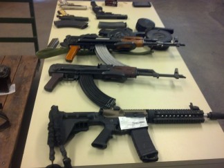 Assault rifle and other weapons shown in photos from the Kern County Sheriffs Office, seized with fully automatic weapons on Paramount Farm land along with 12 people shooting illegally and allegedly poaching. The arrests and citations were a result of a joint action by KCSO and the California Department of Fish and Wildlife. [KCSO photos] 