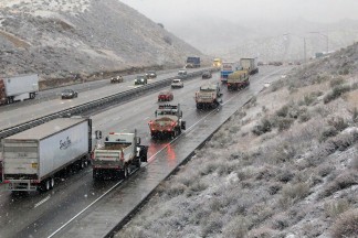 At 5 p.m. the Grapevine is clear, though the road is wet and snow is starting to stick to the foliage at the side of the road. [Jeff Zimmerman photo]