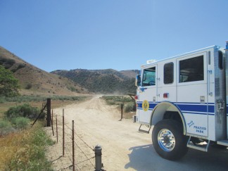 Kern County Fire Department engine 57 heads out to the crash site of an aircraft reported down on Tejon Ranch, Wednesday morning, April 15. [photo by Gary Meyer]