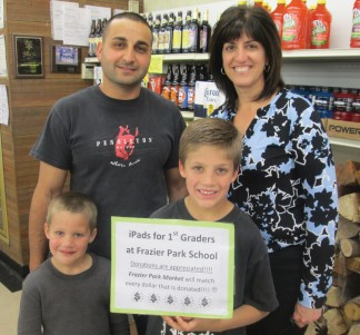 Frazier Park Market manager Ray Akari and Frazier Park School teacher Mary Hon with (l-r) first-grader Jackson Watts and fourth-grader Nathan Vogelsang [photo by Gary Meyer]