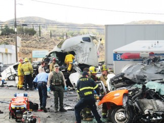 The scene of the collision of a Hall Ambulance Service vehicle with a big rig truck in front of Flying J on May 13, 2015. [photo by Gary Meyer]