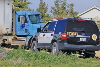 An L.A.  County Sheriff responded to an illegal dumping call near 289th Street West and Mimi  Lane on March 28. Unprocessed slash was emitting a ‘noxious odor’ residents said. [photo by Jeff Zimmerman]