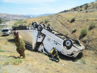 A big rig sits on its roof after rolling over to the southbound onramp of Interstate 5 just south of Frazier Mountain Park Road Tuesday morning. [photo by Gary Meyer]