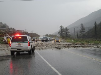 Frazier Mountain Park Road west of Frazier Park is covered with debris from Woods Drive, 1/2 mile east of Midway Market.Mud, water and rocks are covering the road.. Traffic is backed up and detours are recommended. [photo by Gary Meyer for The Mountain Enterprise]