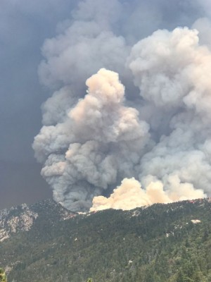 The haze in the skies over the Mountain Communities this week is said to be coming from the Ferguson fire to the north which is threatening Yosemite. Meanwhile, a major complex of fires has developed to the south of us, in Riverside County, shown here. [photo by Jeff Zimmerman]